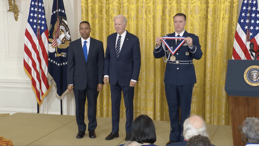Dr. Juan Gilbert receives medal from President Biden